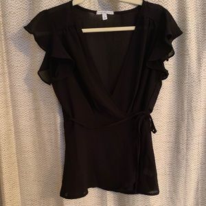 Black wrap top with flutter sleeves.